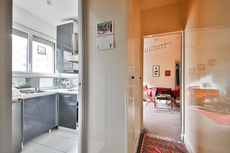 Achat appartement Paris 15 Montparnasse séjour lumineux avec grande baie vitrée 