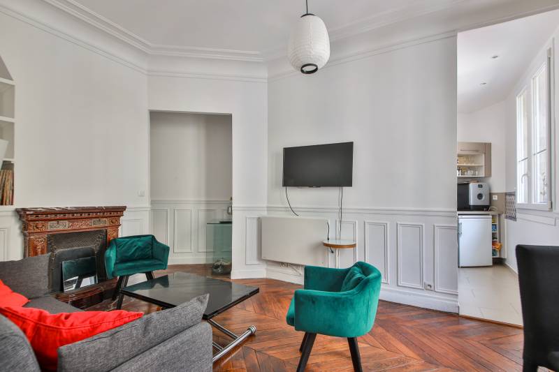 Séjour aux charmes de l'ancien d'un appartement dans le centre ville de Paris à vendre